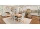 Open-concept kitchen and living space with a breakfast nook and fireplace, perfect for gatherings at 3290 Camellia Ln, Suwanee, GA 30024