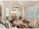 Bright living room with decorative cowhide rug, comfortable seating, and lots of natural light at 3290 Camellia Ln, Suwanee, GA 30024