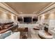 Spacious media room with mounted TVs, comfortable seating, and stylish decor for entertainment at 3290 Camellia Ln, Suwanee, GA 30024