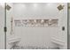Large glass shower features dual shower heads, bench seating, and white tiling at 3290 Camellia Ln, Suwanee, GA 30024