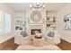 Cozy sitting room with fireplace, built-in shelving, and abundant natural light at 3290 Camellia Ln, Suwanee, GA 30024