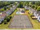 Aerial view showcases a community pool, tennis courts, and lush landscaping at 11151 Aliyah Dr, Hampton, GA 30228