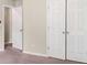 Bedroom with a view of a double door closet and a view to another room at 11151 Aliyah Dr, Hampton, GA 30228