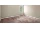 Bedroom featuring a window, neutral paint, and carpet at 11151 Aliyah Dr, Hampton, GA 30228