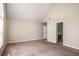 Bedroom featuring carpet, neutral paint, and an ensuite bathroom at 11151 Aliyah Dr, Hampton, GA 30228