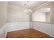 Bright dining area with hardwood floors, decorative molding, and elegant lighting at 11151 Aliyah Dr, Hampton, GA 30228