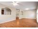 Spacious living room with hardwood floors, featuring an open layout and ample natural light at 11151 Aliyah Dr, Hampton, GA 30228