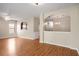 Open living room with hardwood floors, neutral walls and arched doorway at 11151 Aliyah Dr, Hampton, GA 30228