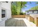 Back deck with wood railing, offering space to unwind in the backyard at 1934 Westwood Sw Ave, Atlanta, GA 30310
