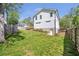 Backyard with a lush green lawn, enclosed by a wooden fence at 1934 Westwood Sw Ave, Atlanta, GA 30310