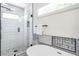 Bathroom featuring a modern shower with stylish tile and a luxurious soaking tub at 1934 Westwood Sw Ave, Atlanta, GA 30310
