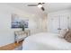 Bright bedroom with white walls, wood floors, stylish decor, and a comfortable bed at 1934 Westwood Sw Ave, Atlanta, GA 30310