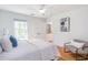 Bedroom featuring a comfortable bed, wood floors, and a cozy reading nook at 1934 Westwood Sw Ave, Atlanta, GA 30310
