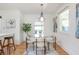 Elegant dining space boasting a modern light fixture, hardwood floors, and tasteful decor at 1934 Westwood Sw Ave, Atlanta, GA 30310