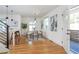 Stylish dining area featuring hardwood floors, modern lighting, and decorative artwork at 1934 Westwood Sw Ave, Atlanta, GA 30310