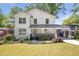 Beautifully renovated two-story home with a well-manicured lawn and a welcoming front entrance at 1934 Westwood Sw Ave, Atlanta, GA 30310