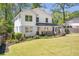 Charming renovated two-story home featuring a landscaped yard and inviting front porch at 1934 Westwood Sw Ave, Atlanta, GA 30310