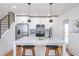 Contemporary kitchen with stainless steel appliances, quartz countertops, and stylish island seating at 1934 Westwood Sw Ave, Atlanta, GA 30310