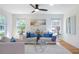 Bright and airy living room features large windows, comfortable seating, and stylish decor at 1934 Westwood Sw Ave, Atlanta, GA 30310