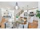 Open-concept living space with modern staircase, stylish dining area, and well-equipped kitchen at 1934 Westwood Sw Ave, Atlanta, GA 30310