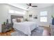 Bright bedroom with large windows, plush bedding, hardwood floors and stylish accents at 1934 Westwood Sw Ave, Atlanta, GA 30310