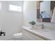 Stylish half-bath with decorative mirror and modern fixtures, perfect for guests at 1934 Westwood Sw Ave, Atlanta, GA 30310
