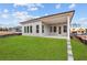 View of backyard featuring gray siding and a covered patio at 214 Strawberry Ln, Woodstock, GA 30189