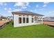 View of backyard featuring gray siding and a covered patio at 214 Strawberry Ln, Woodstock, GA 30189