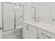 Modern bathroom with glass-enclosed shower and white vanity at 214 Strawberry Ln, Woodstock, GA 30189