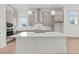 Open kitchen with center island, modern cabinetry and stainless steel appliances at 214 Strawberry Ln, Woodstock, GA 30189