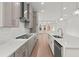 Modern kitchen featuring an island, gray cabinetry, and stainless steel appliances at 214 Strawberry Ln, Woodstock, GA 30189