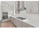 Modern kitchen featuring white subway tile backsplash, gray cabinets and stainless steel appliances at 214 Strawberry Ln, Woodstock, GA 30189