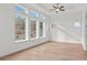 Primary bedroom features a tray ceiling, ample windows, and natural light at 214 Strawberry Ln, Woodstock, GA 30189
