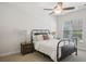 Bedroom with a ceiling fan, queen bed, and bedside tables with lamps at 346 Ardmore Ct, Atlanta, GA 30309