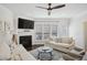 Comfortable living room featuring a fireplace, ceiling fan and stylish furnishings at 346 Ardmore Ct, Atlanta, GA 30309