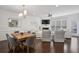 Open-concept living and dining area with dark hardwood floors and bright white trim at 346 Ardmore Ct, Atlanta, GA 30309