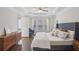 Serene main bedroom with a tray ceiling, hardwood floors, a seating area, and natural light from large windows at 346 Ardmore Ct, Atlanta, GA 30309