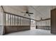 Covered outdoor space with ceiling fans and wooden walls at 1510 Silver Mist Cir, Powder Springs, GA 30127
