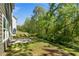 Side view of backyard with lawn and trees at 224 Eva Way, Cartersville, GA 30121