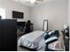 Carpeted bedroom with desk setup and ceiling fan at 224 Eva Way, Cartersville, GA 30121