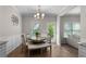 Cozy dining area with table and bench seating under a chandelier at 224 Eva Way, Cartersville, GA 30121