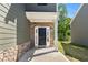 Stylish front entrance with stone accents and a dark-colored front door at 224 Eva Way, Cartersville, GA 30121