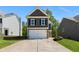 Charming two-story home with a two-car garage and a long driveway at 224 Eva Way, Cartersville, GA 30121