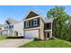Inviting two-story home featuring a two-car garage and well-manicured lawn on a sunny day at 224 Eva Way, Cartersville, GA 30121