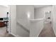 Upstairs hallway with neutral paint leads to additional rooms at 224 Eva Way, Cartersville, GA 30121