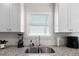 Close-up of kitchen sink and countertops under a bright window at 224 Eva Way, Cartersville, GA 30121