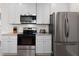 Modern kitchen with stainless steel appliances and granite countertops creates a functional space at 224 Eva Way, Cartersville, GA 30121