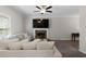 Bright living room with a stone fireplace, a TV, and ample seating at 224 Eva Way, Cartersville, GA 30121