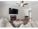 Inviting living room with a stone fireplace, a TV, and hardwood floors at 224 Eva Way, Cartersville, GA 30121