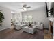 Spacious living room featuring a comfortable sectional sofa and adjacent dining area at 224 Eva Way, Cartersville, GA 30121